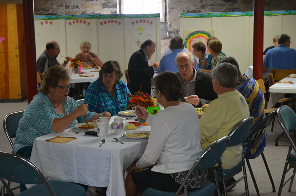 Many people stayed following the service and dedication to enjoy the food and fellowship.